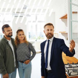 Real estate agent showing a home to a couple