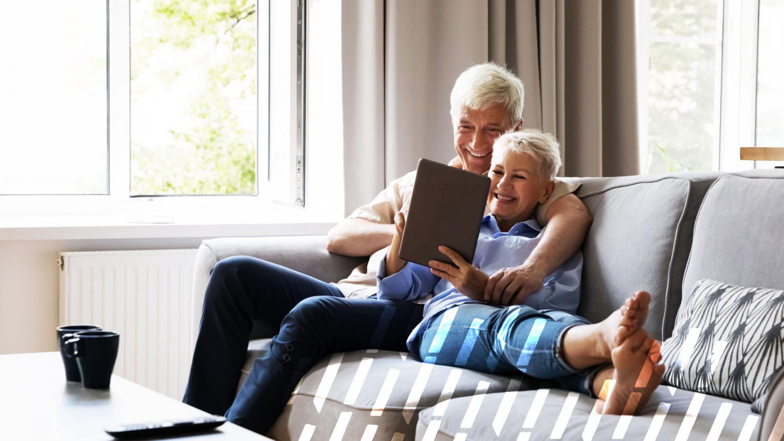 Old couple relaxing on the couch